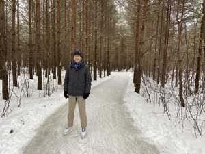 Asian man ice skaing in forest