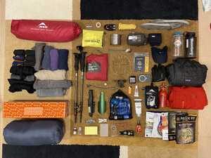 Camping gear laid out on floor