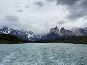 Mountains across from blue lake on cloudy day