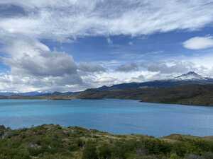 Blue lake with mountain behind