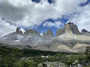 Mountain ridge rising above forest