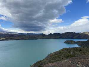 Blue lake in front of mountains