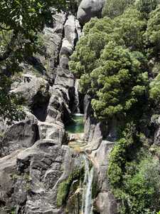 Pool undernearth waterfall
