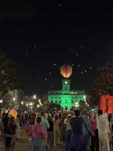 Balloon going up in square at night