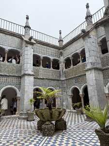 Courtyard with two story building and tiles