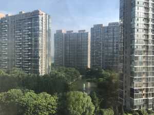 High-rise apartments around pond