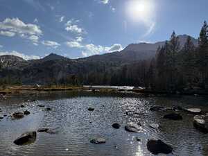 Lake in sunlight in mountains