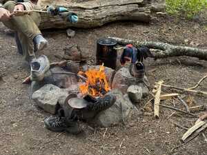 campfire with wet gear around