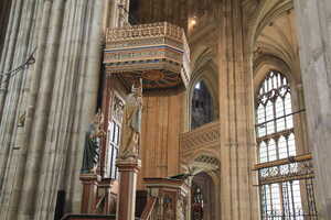 Elaborate wooden pulpit in stone cathedral