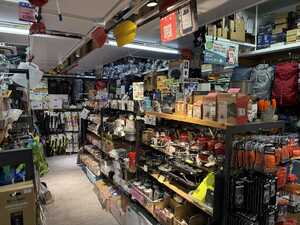 Crowded store with outdoors gear in aisles