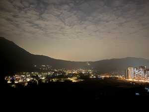 Town at night with lights in a valley