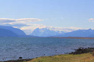 Mountain across lake shore