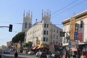Corner building with church in background