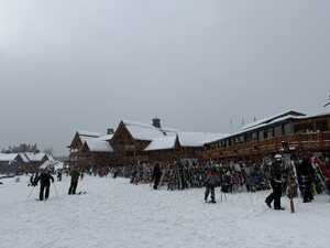 Ski lodge in snow with skis outside