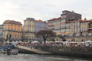 Colorful houses with crowd by river front
