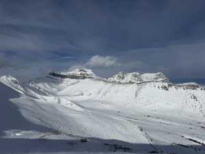 Snowy mountain peak in fog