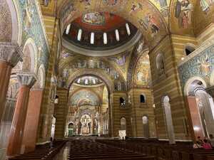 Interior of large church with gold tile mosaic