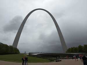 Concrete arch against gray sky