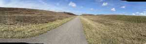 Path through grassy hills