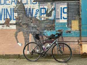 Bicycle in front of mural