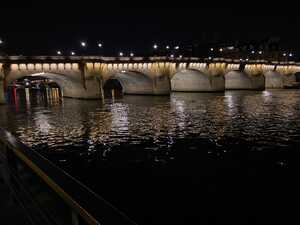 Bridge across river at night