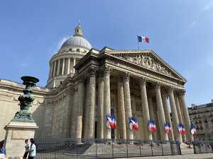 Roman-looking building with French flags
