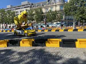 Large, inflatable cyclist on car