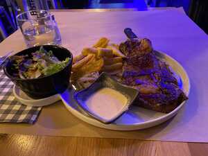 Steak with fries and salad