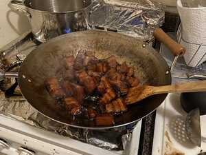 Braised pork belly in a wok