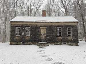 Wooden cabin in snow