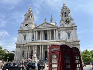 Red telephone box in front of old church