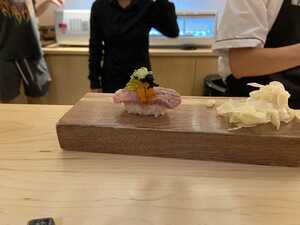 Piece of sushi on wood