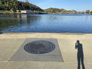 Circle on ground in front of water