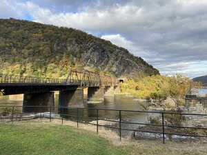 Rail bridge from rock across river