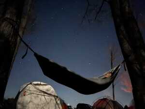 Man in hammock at night