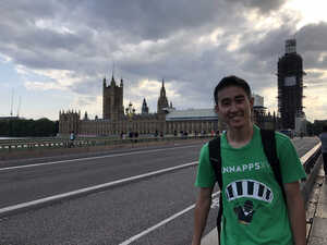 Asian man in front of British Parliament