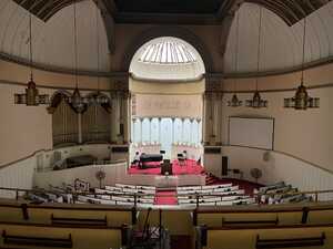 Cavernous church interior looking down on pews