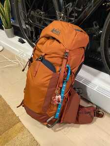 Orange backpack in front of bike and window