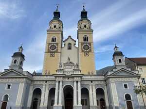 Church with blue base and two yellow clock towers