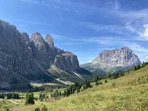 Tree-filled valley with mountains around