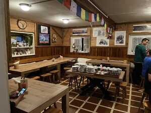 Wooden dining room with flags on rafters