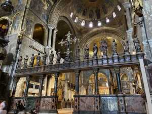 Interior of church with golden dome and colunnade