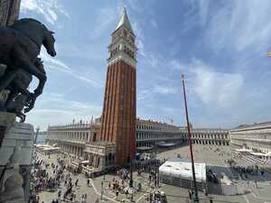 Prominent brick tower in classical courtyard