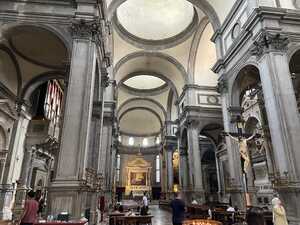 Church with square stone columns and domes