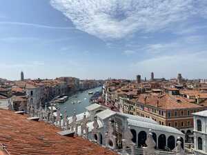 Rooftop view over canal with red roofs around it