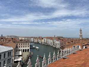 Another rooftop view over canal with red roofs around it