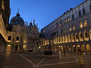 Courtyard at night with yellow lights