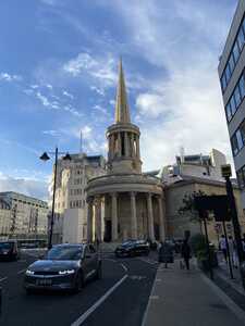 Cylindrical church with pointy spire on top