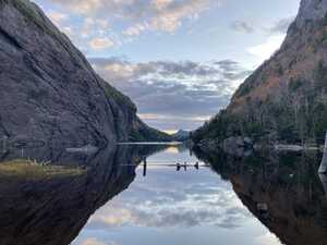 Lake between rock walls at dusk