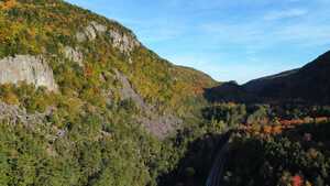 Highway and cliff in forest from above